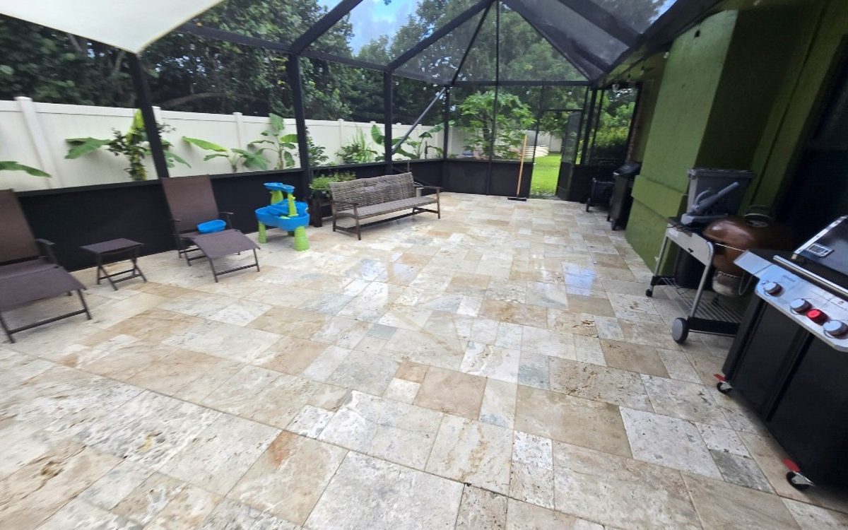 The same stone patio clean and bright after cleaning